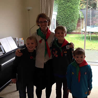 Aline and her children getting ready for Beaver Scouts!