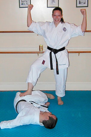 Sarah 'defeating' her husband during karate training. The photo was taken by David Gomez, her karate instructor in the USA.