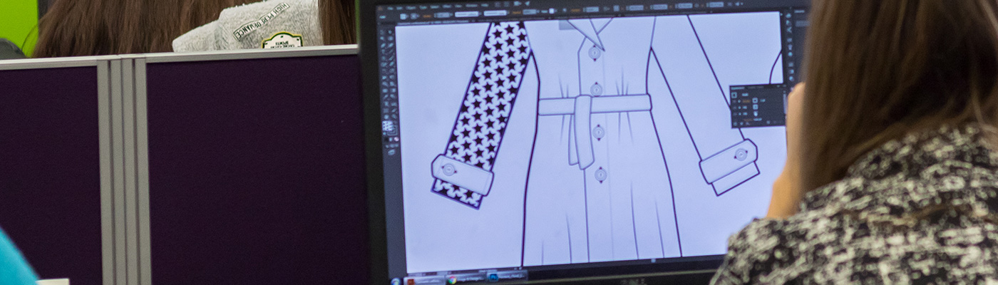 Student working on fashion designs on screen