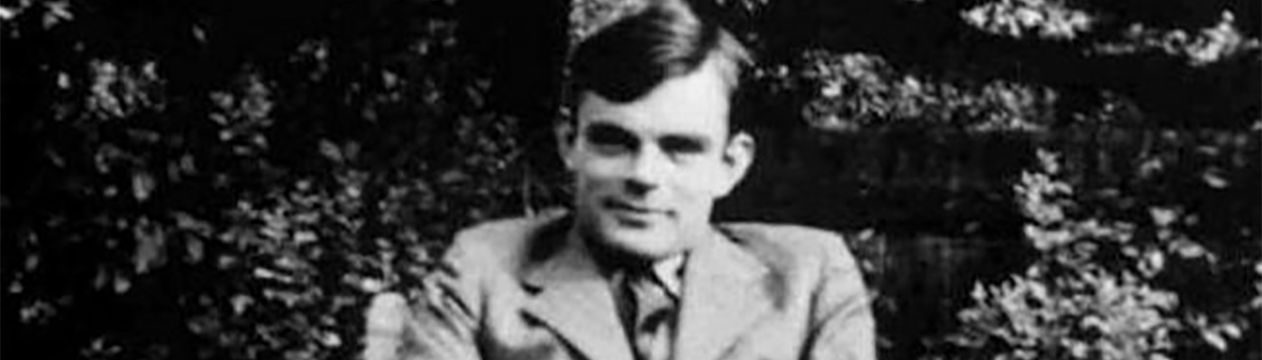 Alan Turing smiling at the camera
