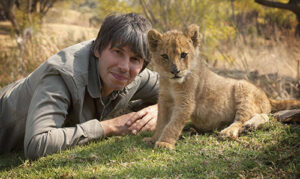Professor Brian Cox with lion