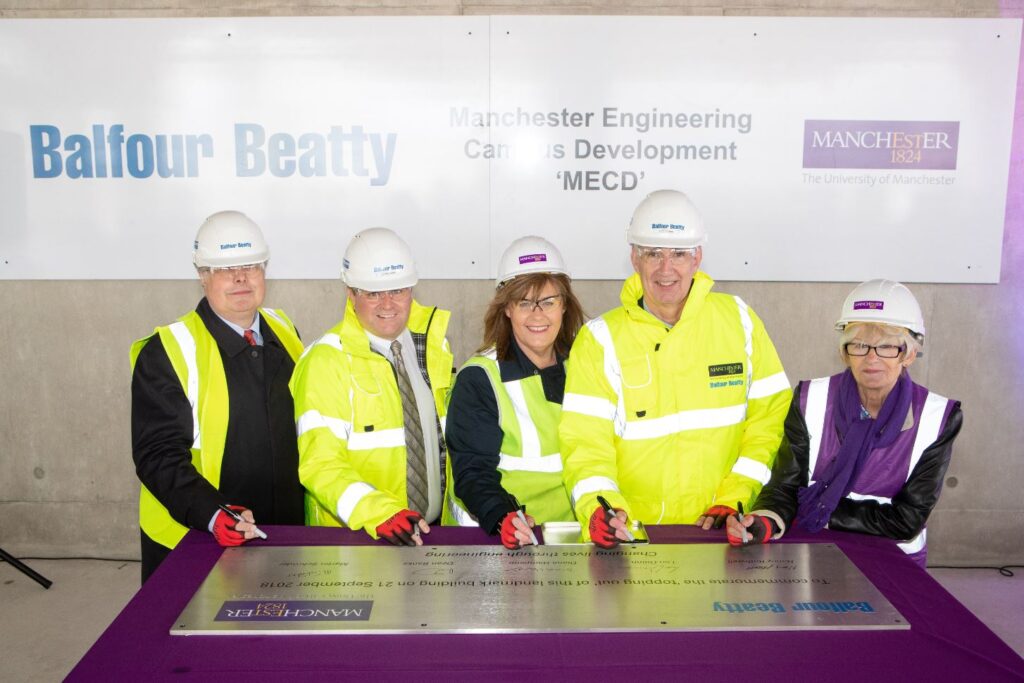 Signing girder at MECD topping out