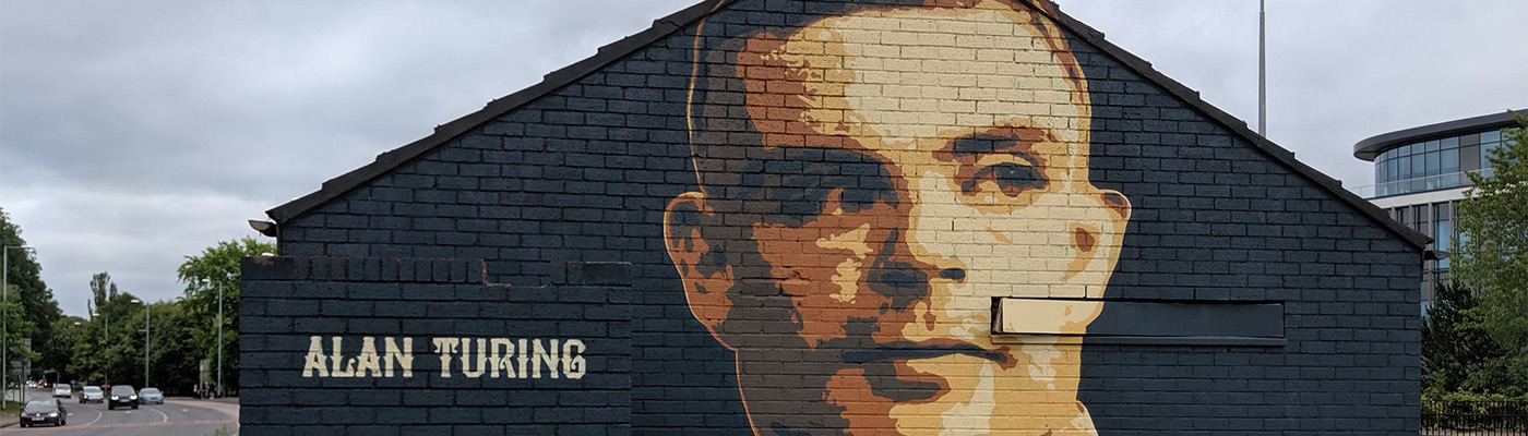 Alan Turing mural on the side of a building