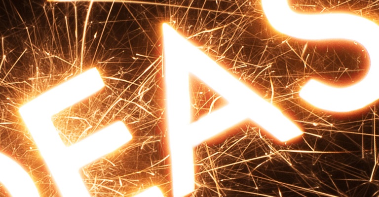 A close up of the word 'ideas' with sparks coming from it